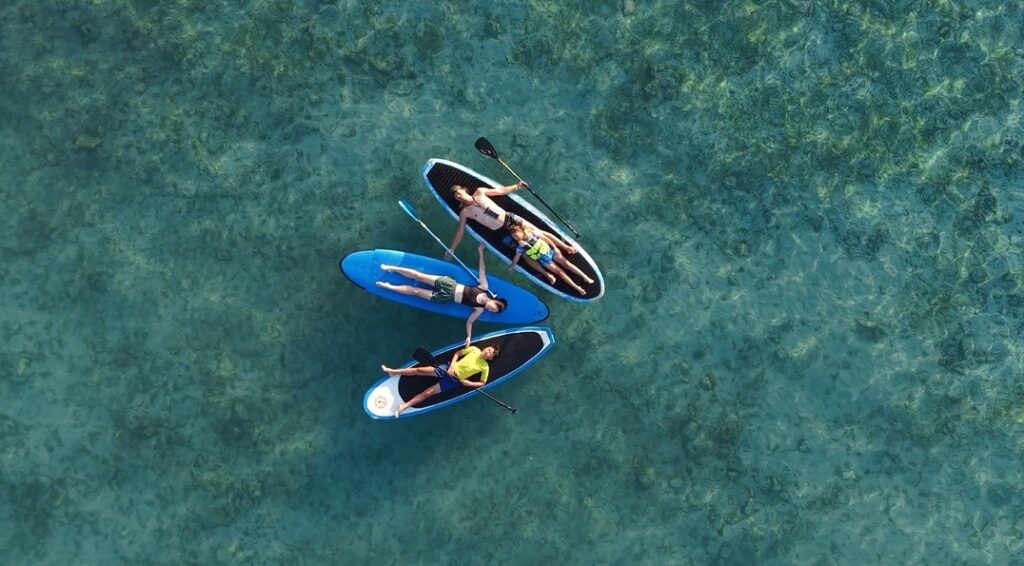 Gili Islands Things To Do paddleboarding family photo by drone