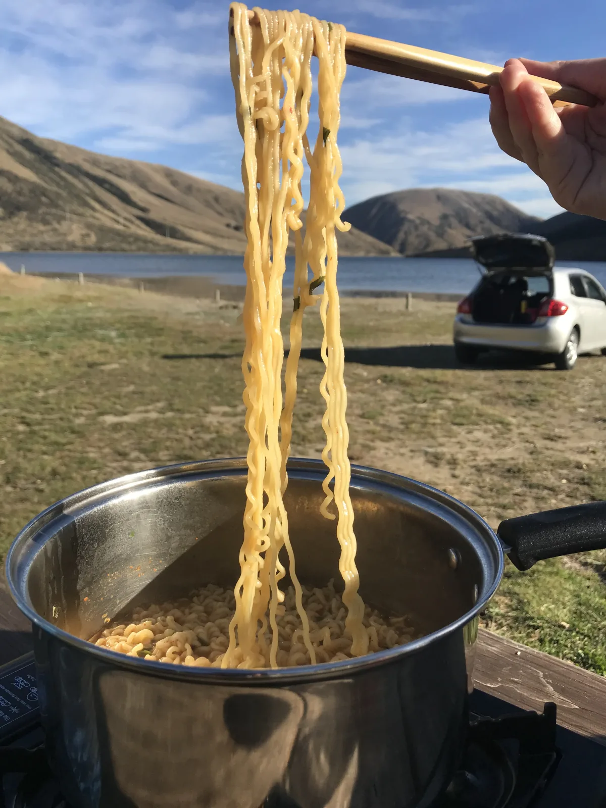 nothing better than slurping hot noodles while looking out over a serene alpine lake
