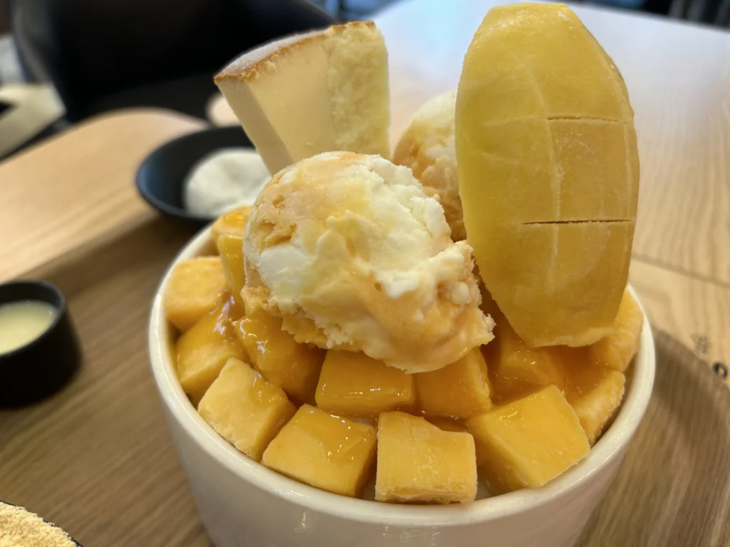 Korean Shaved Ice: Sulbing mango shaved ice layered with fresh fruit.