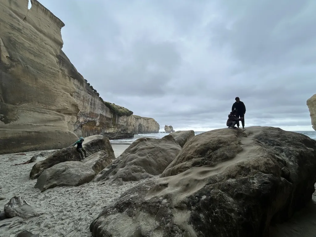 Here's the hidden good part: rainy weather makes Tunnel Beach more dramatic. The cliffs look heavier under grey sky. The mist rolls through the arch. The lighting is genuinely moody. We've heard from families who returned on sunny days and found it beautiful but flatter.