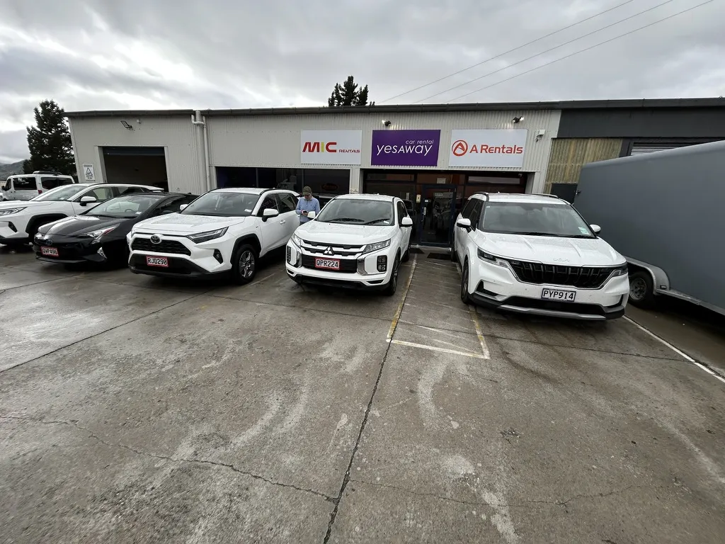 NZ rental car insurance — Kia Carnival rental car pickup at New Zealand rental depot