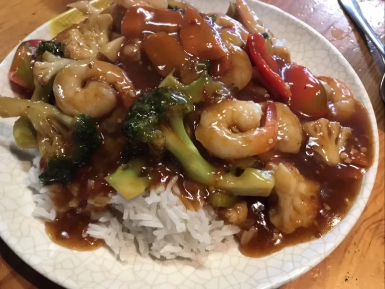 Mt Albert BBQ Noodle House
“Hot & Spicy Prawns with vegetables on a ceramic plate.”