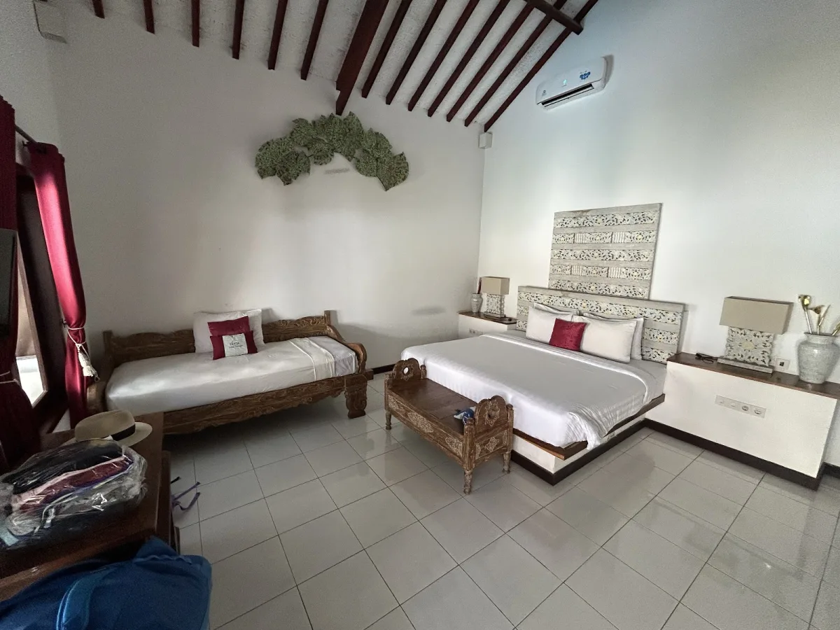 Gili accommodation Cinta Cottage Interior shot showing the king bed and sofa bed